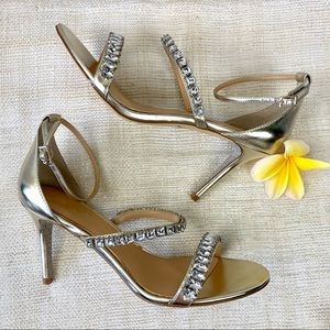 JEWEL BADGLEY MISCHKA Gold Metallic Sandals with Rhinestone Embellishment.
